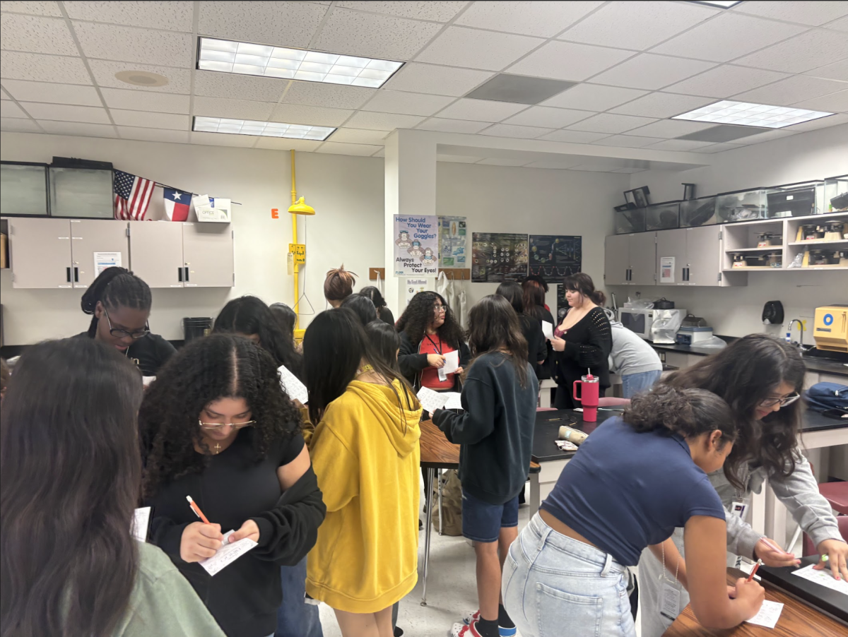 Scattering Around. FEMS in STEM Club members play an intense game of Human Bingo during their first general meeting. With new faces all across the room, the ice breaker helped all members familiarize themselves with one another. "It was a very fun experience," officer Erica Carranza said.